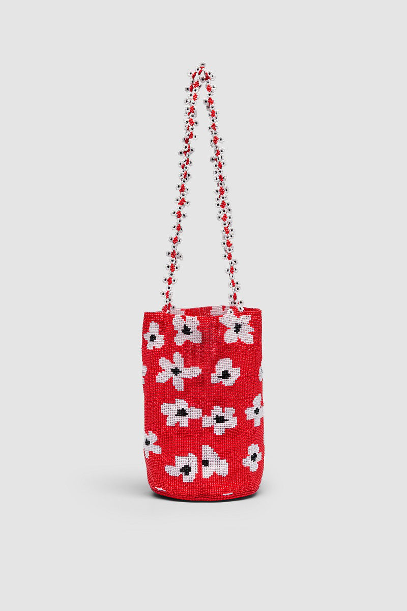 Red shoulder bag with a floral design from Pura Utz, featuring a vibrant red flower pattern on a sleek bag.