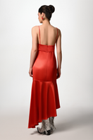 Red slip dress by Liya, midi-length with a sleek design, featuring thin straps and a fitted silhouette, shown on a model.