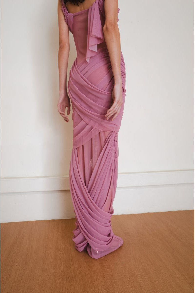 Close-up of the back of the pink Reflection gown by YASSMIN SALEH, a stylish maxi dress with elegant detailing.