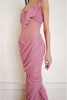 Close-up of YASSMIN SALEH pink Reflection gown, a flowing maxi dress with elegant fabric and detailed design.