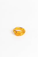 Salvária Remolino rings set with pink, amber, and white rings featuring swirling designs on a white background.