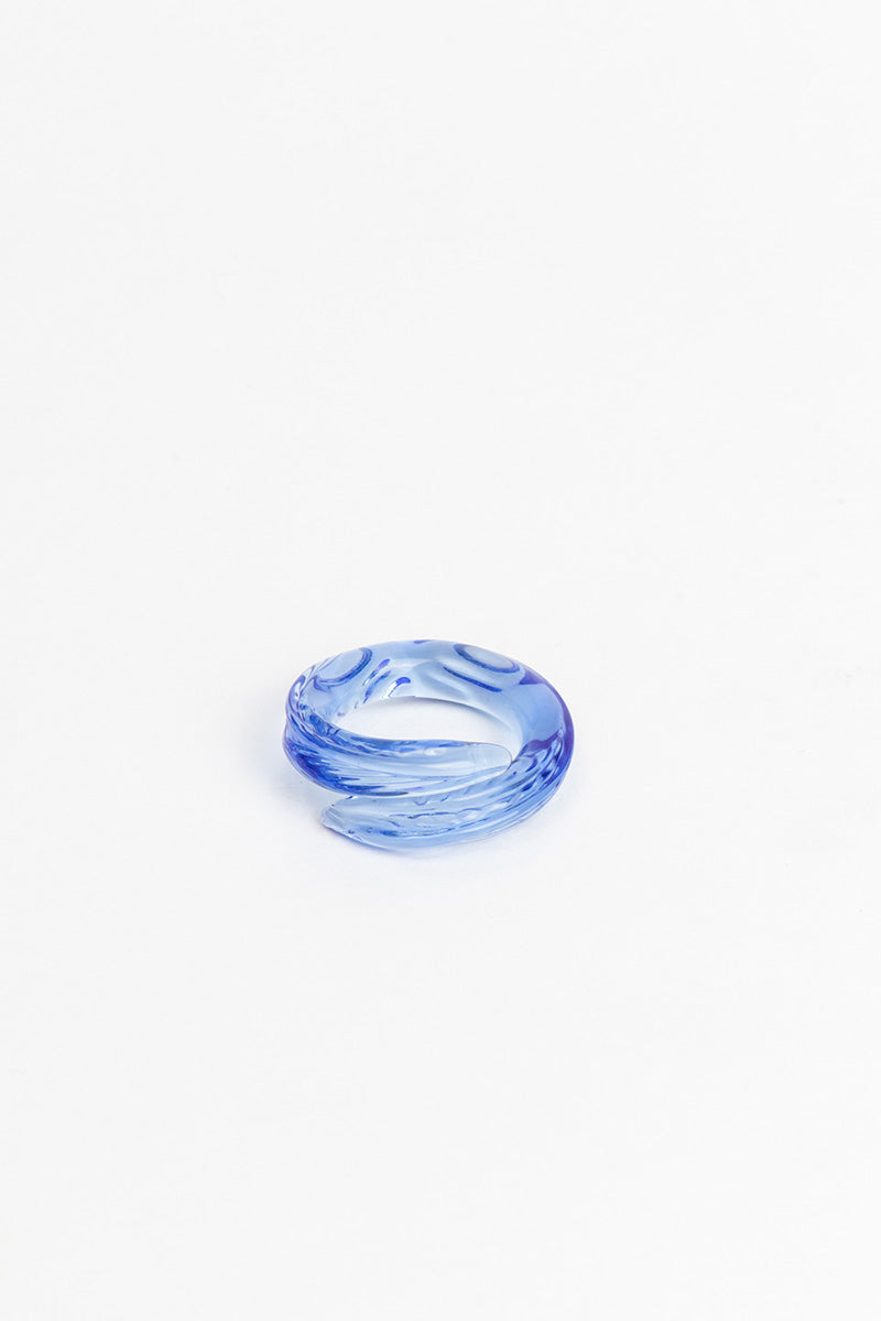 Set of SALVÁREA Remolino rings featuring turquoise, green, and ocean blue colors with swirling design details.