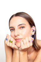 Set of SALVÁREA remolino rings featuring turquoise, green, and ocean blue colors in a swirling design.