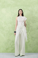 Lecia hibiscus straight wide-leg twill floor-length pants in a natural beige color, featuring a relaxed fit and visible side pockets.