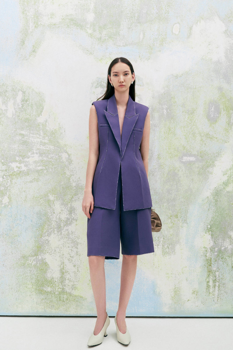 Lecia statement straight sleeveless twill blazer vest in neutral color, tailored fit with a classic collar and front pockets.