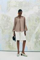 Beige chamomile straight-collared poplin high-low shirt by Lecia, shown with front view highlighting collar and hem details.