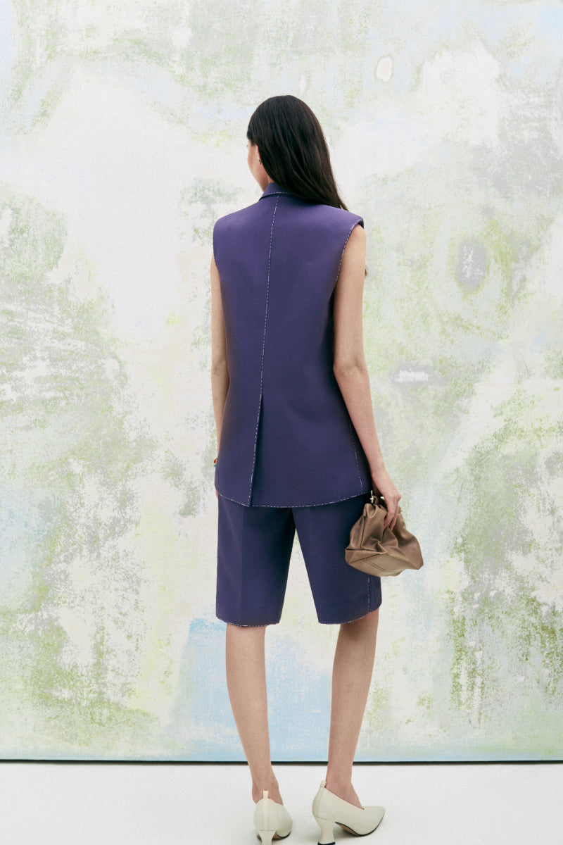 Light beige Leicia sleeveless blazer with straight cut and tailored fit, perfect for layered professional or casual looks.