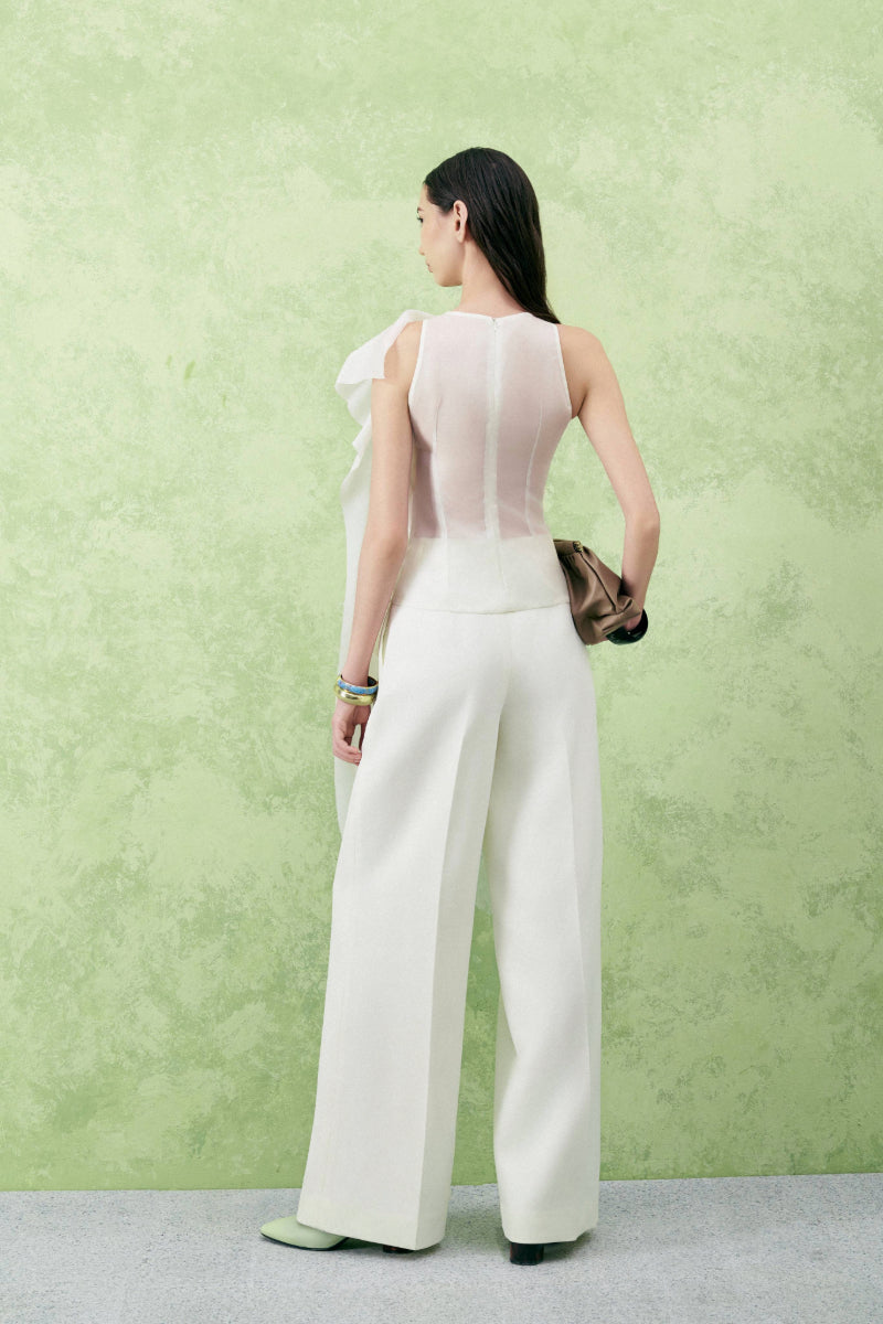 Lecia hibiscus bodycon top with floral appliqué and sheer organza fabric, showcasing a fitted, elegant design.