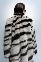 Nana Gotti Chelsea Cool Coat displayed on a hanger, featuring a stylish, lightweight coat with a sleek design and neutral color.