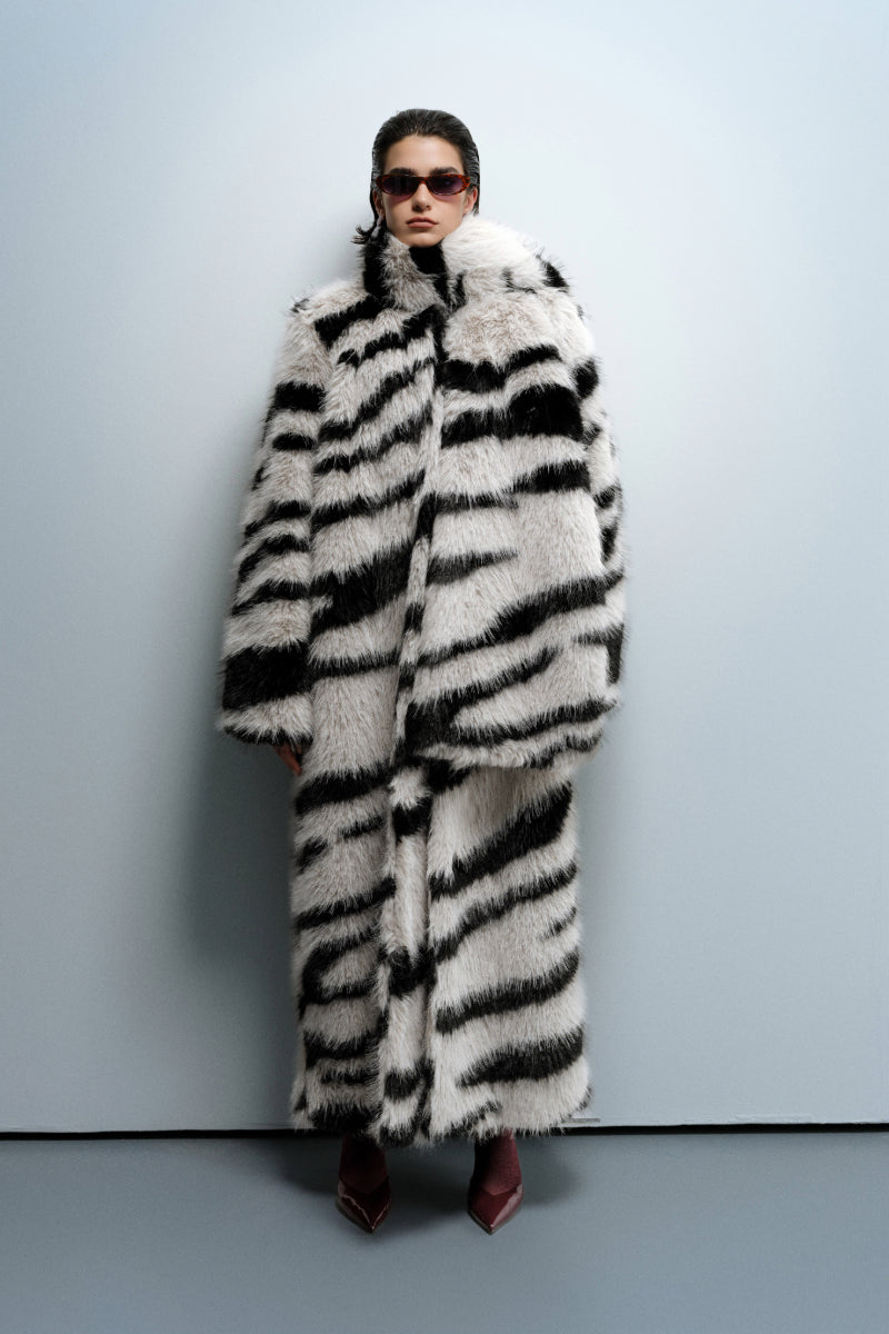 Nana Gotti Chelsea Cool Coat displayed on a hanger, featuring a stylish, lightweight coat with a modern design and neutral color.
