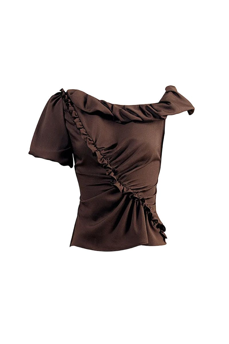 YASSMIN SALEH brown DREAM shirt, a stylish women's top with a relaxed fit and soft fabric, displayed on a hanger.