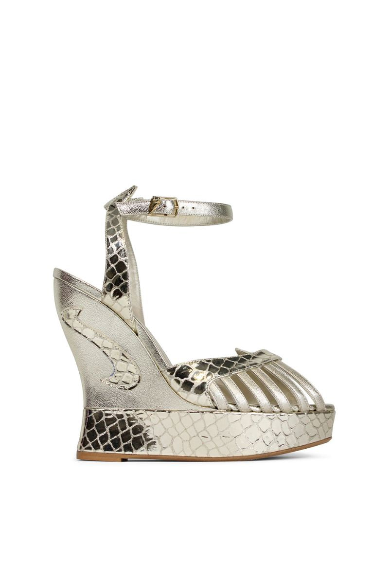 Terry de Havilland MARGAUX gold heels with pointed toes and stiletto heels, showcasing metallic finish and elegant design.