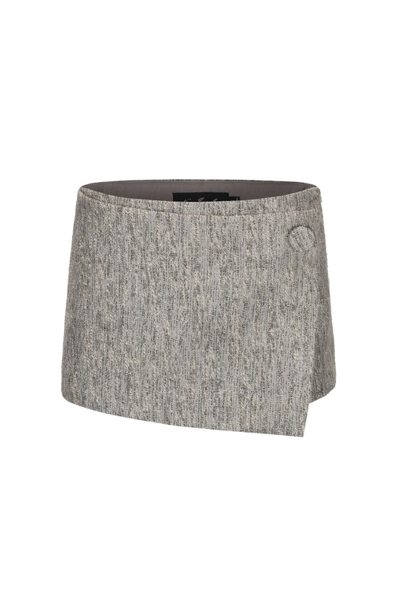 Nana Jacqueline Francesca mini skirt in a stylish, fitted design with a high waist and vibrant pattern, displayed on a hanger.