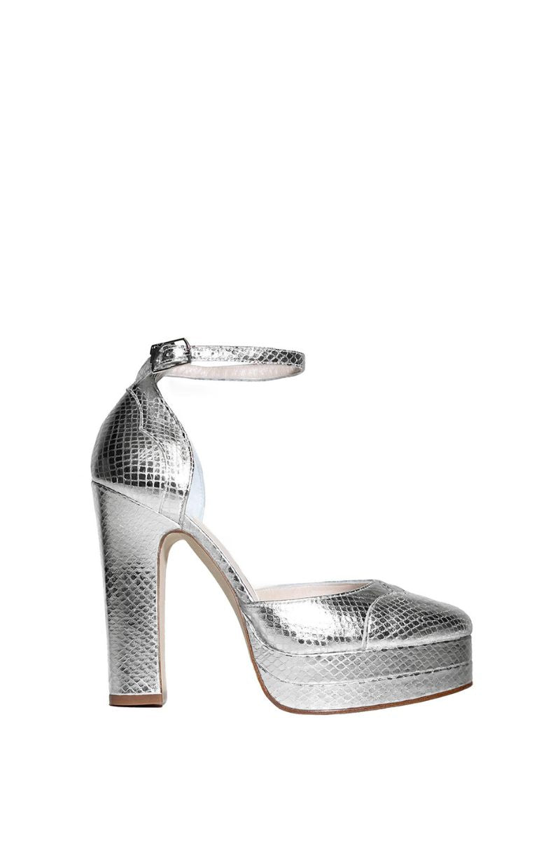 Silver platform heels by Terry de Havilland featuring a sleek heel design and metallic finish, ideal for stylish occasions.