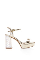 Pair of Gigi Champagne heels by Freya Rose featuring elegant pointed toes and a sleek champagne satin finish.
