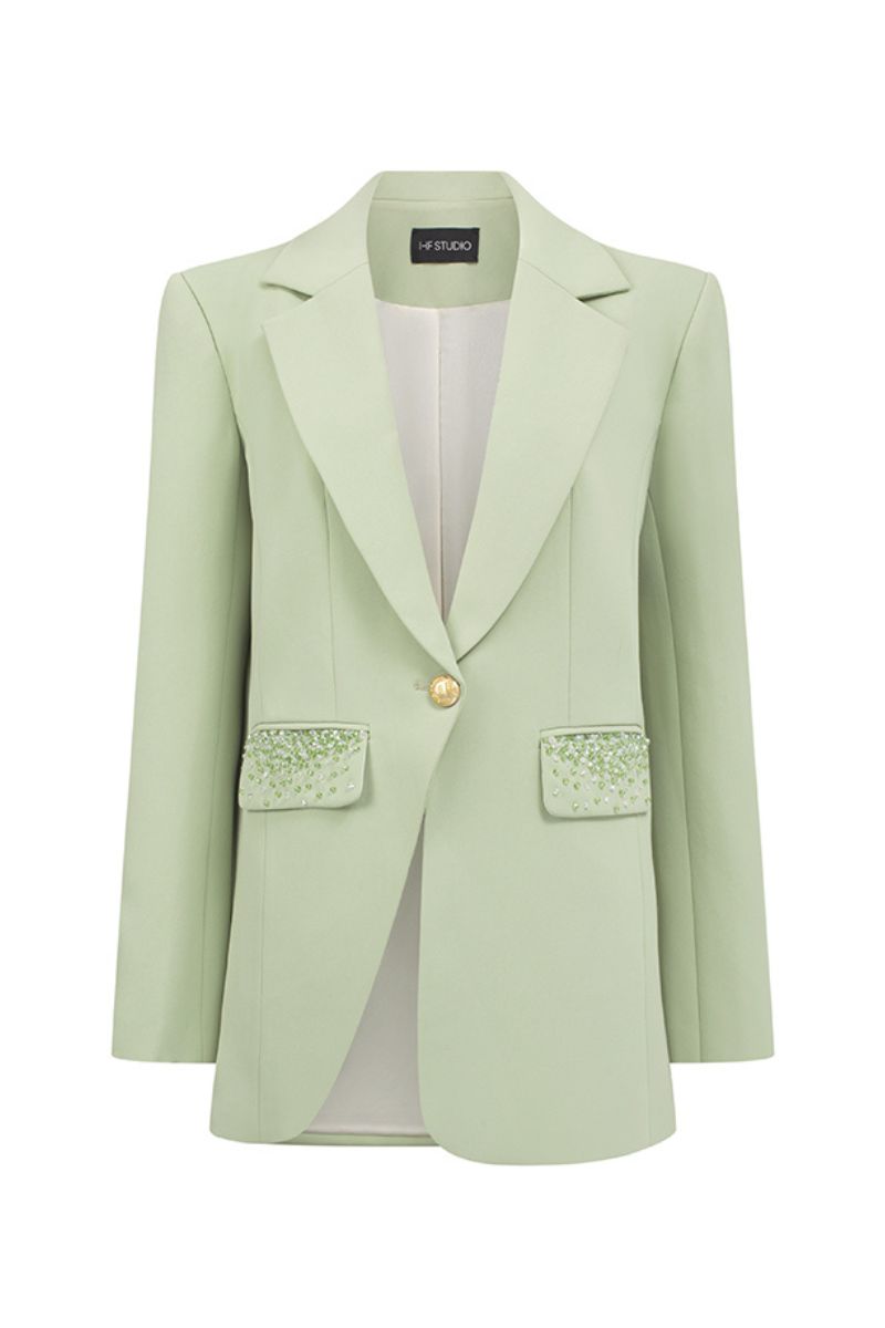 I.H.F Studio mint single-breasted blazer displayed on a hanger, showing its tailored fit and classic lapel design.