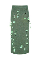 Lalo green hand-knit maxi skirt with embellishments, featuring intricate knit patterns and decorative details.