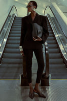 Khanum's KALLISTE black leggings, slim-fit pants made of stretchy fabric, shown on a model with a plain background.