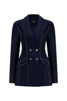 Lili Blanc double-breasted tailored denim blazer displayed on a hanger, showcasing its structured fit and classic design.