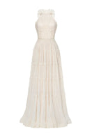 Ivory tiered halter gown by Montsand featuring a flowing, layered design and halter neckline, perfect for elegant occasions.