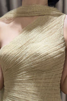 Elegant gold draped gown by Montsand featuring flowing fabric and sophisticated design, perfect for formal occasions.