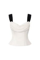 Nana Jacqueline GIA TOP IN WHITE, stylish sleeveless blouse with a high neckline and elegant design, displayed on a hanger.