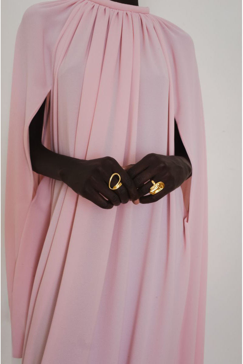 Close-up of YASSMIN SALEH Resonance Pink Maxi Dress showing elegant fabric and detailed design on the pink dress.
