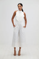 Ivory resort jumpsuit by ANA + MARIA featuring a relaxed fit, wide legs, and stylish straps, perfect for warm-weather wear.