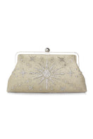 Gold embellished classic clutch bag by Sarah's Bag featuring elegant design and compact style for evening occasions.