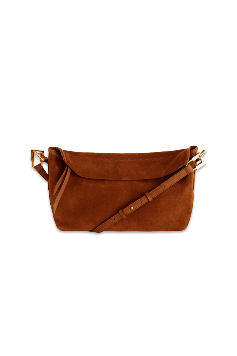 Tan suede Rivera handbag by Isidora Malva featuring a stylish top handle design and elegant craftsmanship.