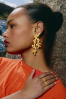 Gold riverstone earrings by Jude Benhalim featuring elegant, polished riverstone stones set in a stylish earring design.