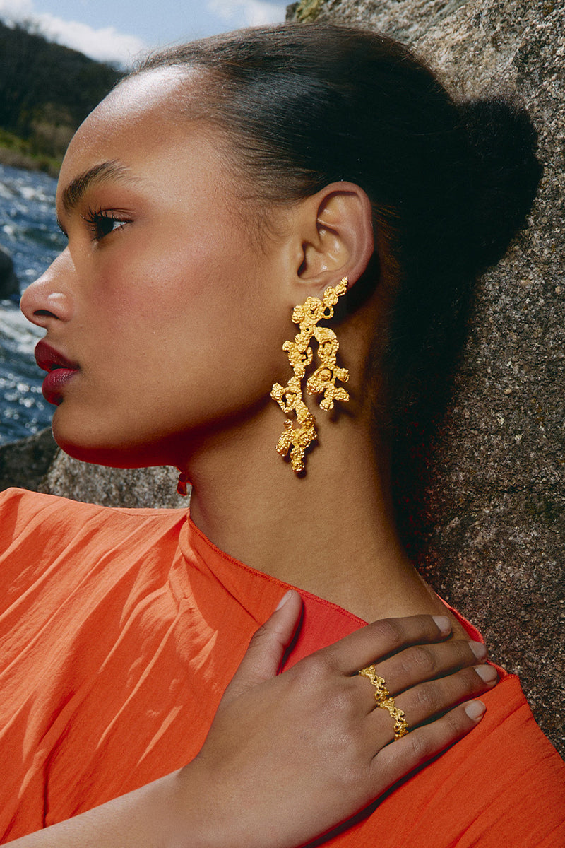 Gold riverstone earrings by Jude Benhalim featuring elegant, polished riverstone stones set in a stylish earring design.