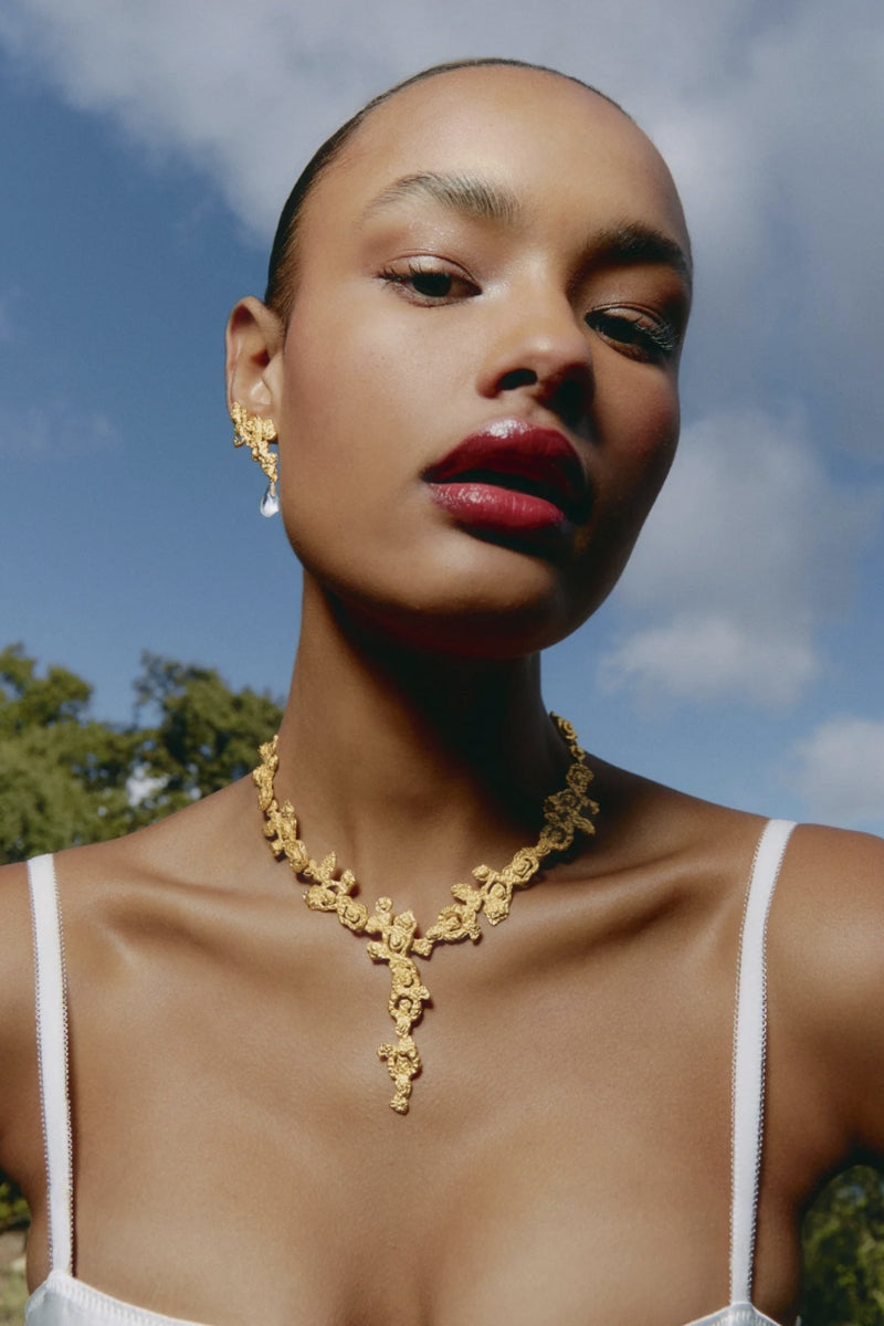 Gold Riverstone necklace by Jude Benhalim featuring a polished riverstone pendant on a delicate chain.