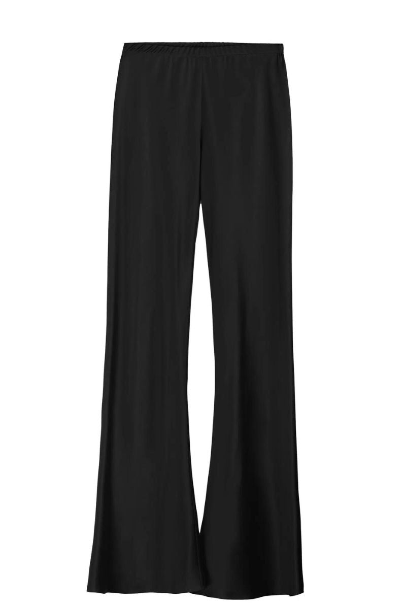 Serenity Riviera black silk satin flared pants displayed on a hanger, showcasing their smooth fabric and wide-leg design.