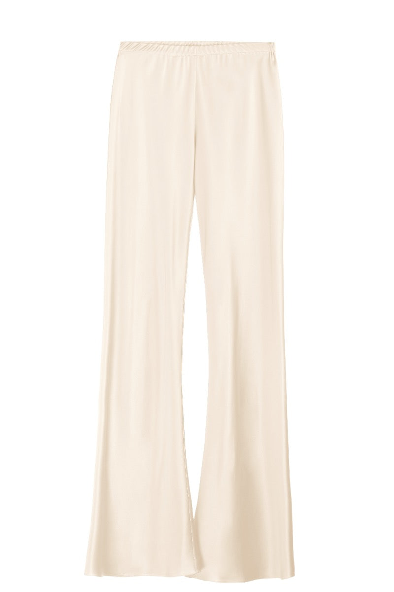 Cream silk-satin bias-cut slim pants by Serenity, shown on a model, featuring a sleek, tailored fit with smooth fabric details.