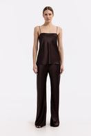 Serenity Riviera espresso silk-satin bias-cut slim pants displayed flat, showcasing their smooth fabric and sleek silhouette.