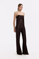 Serenity Riviera espresso silk-satin bias-cut slim pants, shown in a stylish image highlighting the smooth fabric and tailored fit.