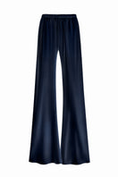 Serenity Riviera navy silk-satin bias-cut slim pants displayed on a model, showcasing elegant, smooth fabric and tailored fit.