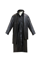 Black Cooper coat jacket by Deme By Gabriella, displayed on a model with a casual outdoor setting.