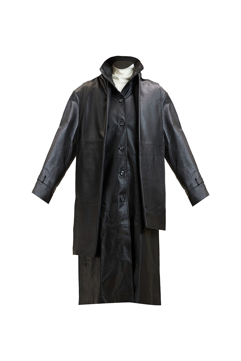 Black Cooper coat jacket by Deme By Gabriella, displayed on a model with a casual outdoor setting.