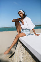 White Rohe cropped top by ANA + MARIA, featuring a stylish, fitted design perfect for casual or trendy outfits.