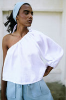 White Rohe cropped top by ANA + MARIA, stylish sleeveless blouse with a fitted design, perfect for casual or trendy outfits.