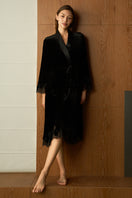 Black velvet lace robe by MANITO featuring intricate lace details, soft fabric, and a relaxed fit, perfect for luxury loungewear.