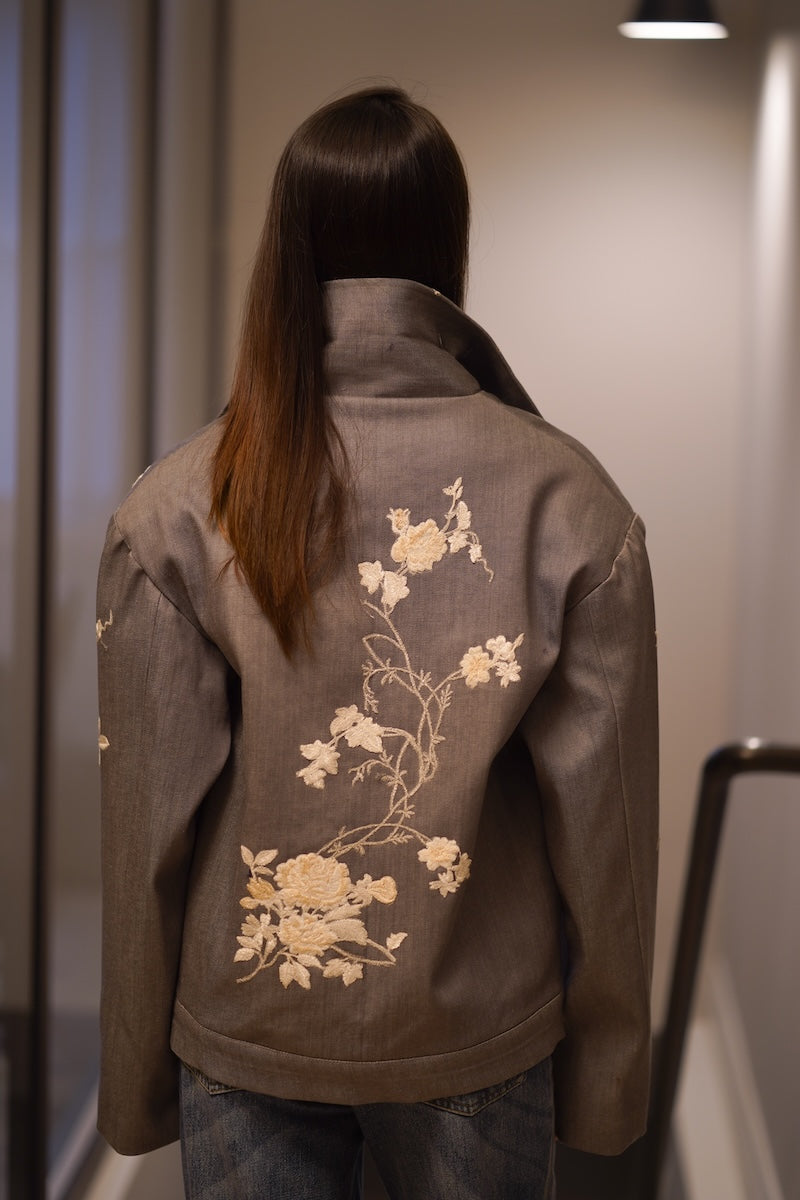 Nadya Shah Rosalind Gray Denim Jacket back view, casual jackets with classic stitching and fitted style on a model.