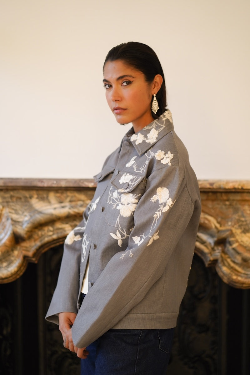 Nadya Shah Rosalind Gray Denim Jacket shown from the side, featuring classic denim design and stylish fit.