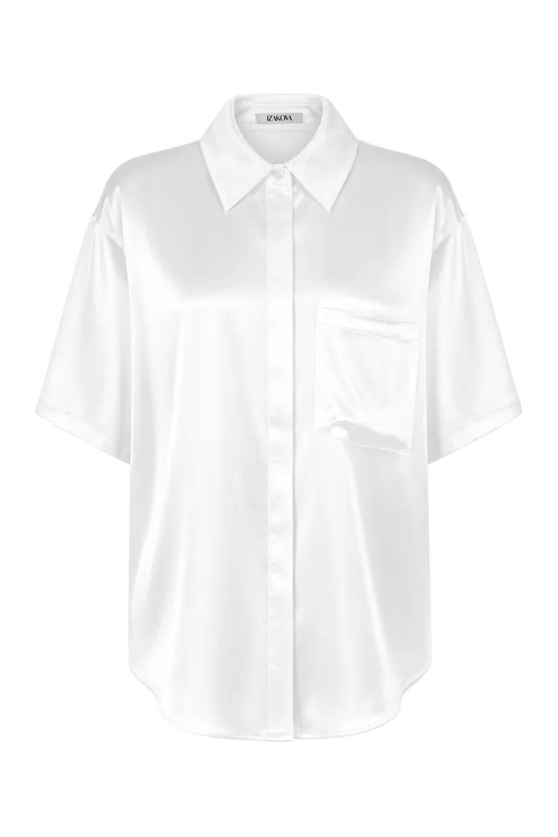 White Rosa shirt by Izakova, lightweight cotton shirt with a classic fit and button-down front, shown on a hanger.