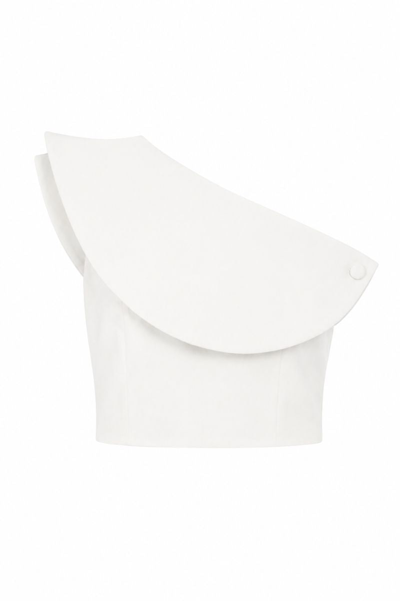 Ivory ROSAVE crop top by ANA + MARIA displayed on a ghost mannequin, showcasing its fitted style and soft fabric.