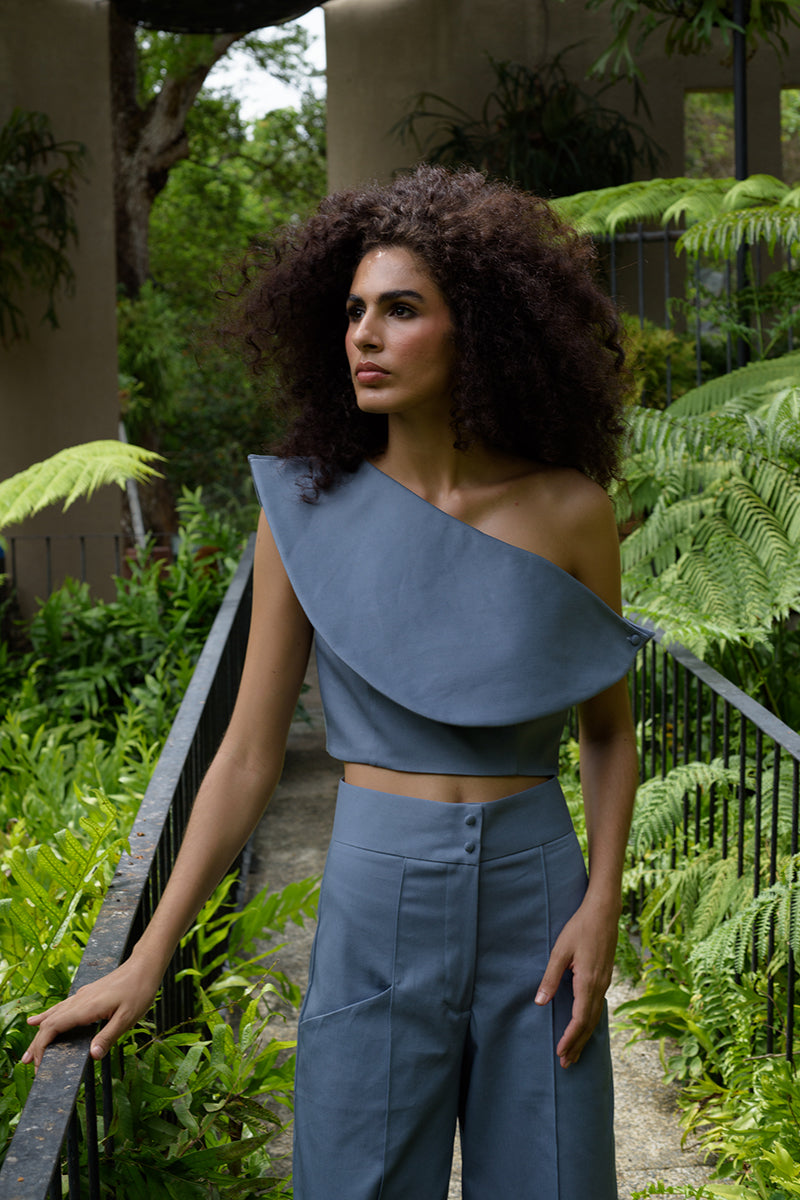 ANA + MARIA Rosave crop top in tempest color, featuring a stylish, fitted design, shown on a model in a fashion campaign photo.