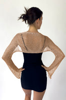 Back view of Natalia Fedner rose gold chain bolero shrug, a stylish cardigan with intricate chain details in a shimmering rose gold finish.