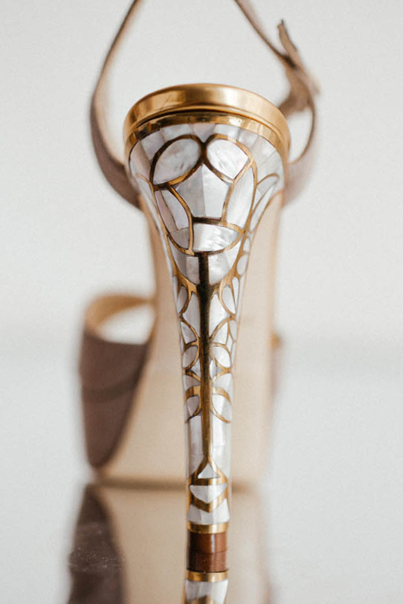 Taupe suede heel sandals with rose in bloom shimmer details by Freya Rose, featuring elegant open-toe design and ankle strap.